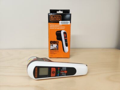 A thermal leak detector with its box behind it